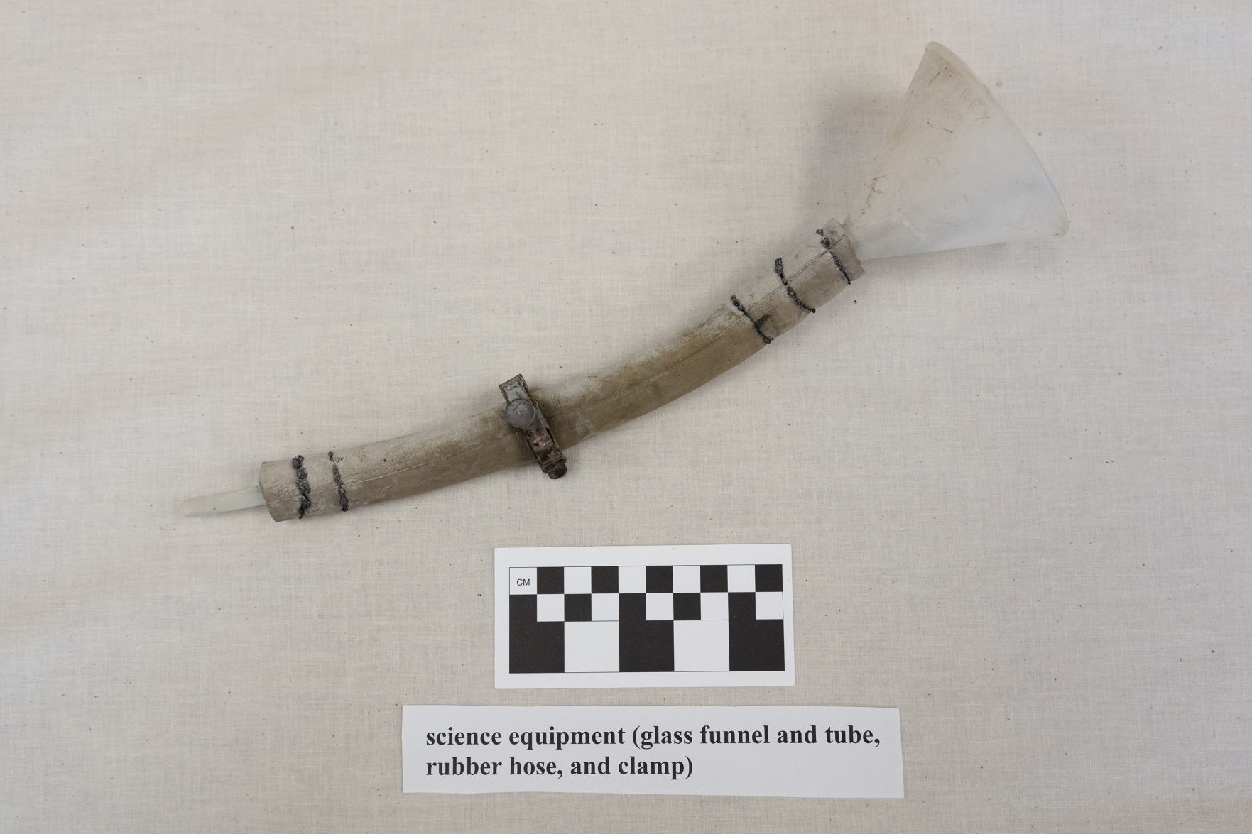 Science equipment: glass funnel and tube with rubber hose